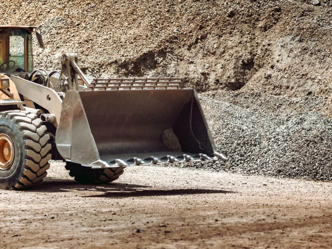 A bulldozer inside a mine pit ready for uranium mining